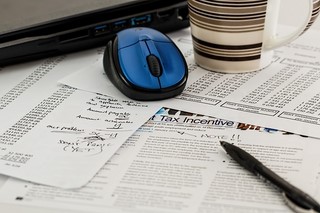 messy desk with tax forms